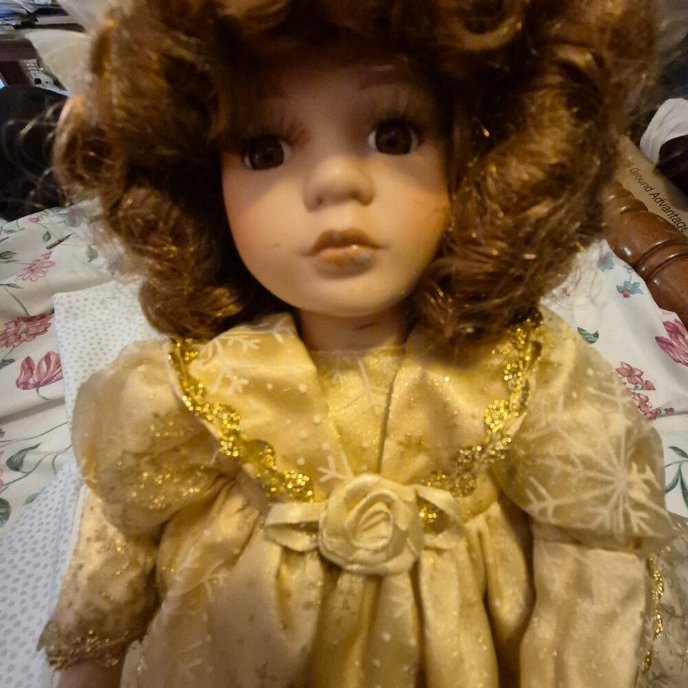 Seated Musical Doll. Her head moves while music plays.